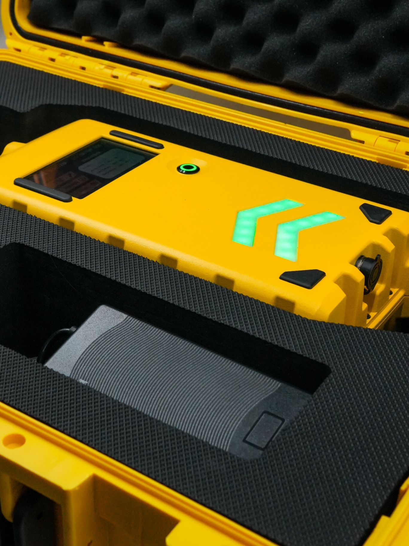 Aero-Jolt unit and accessories seated in its shock-proof foam-lined carrying case