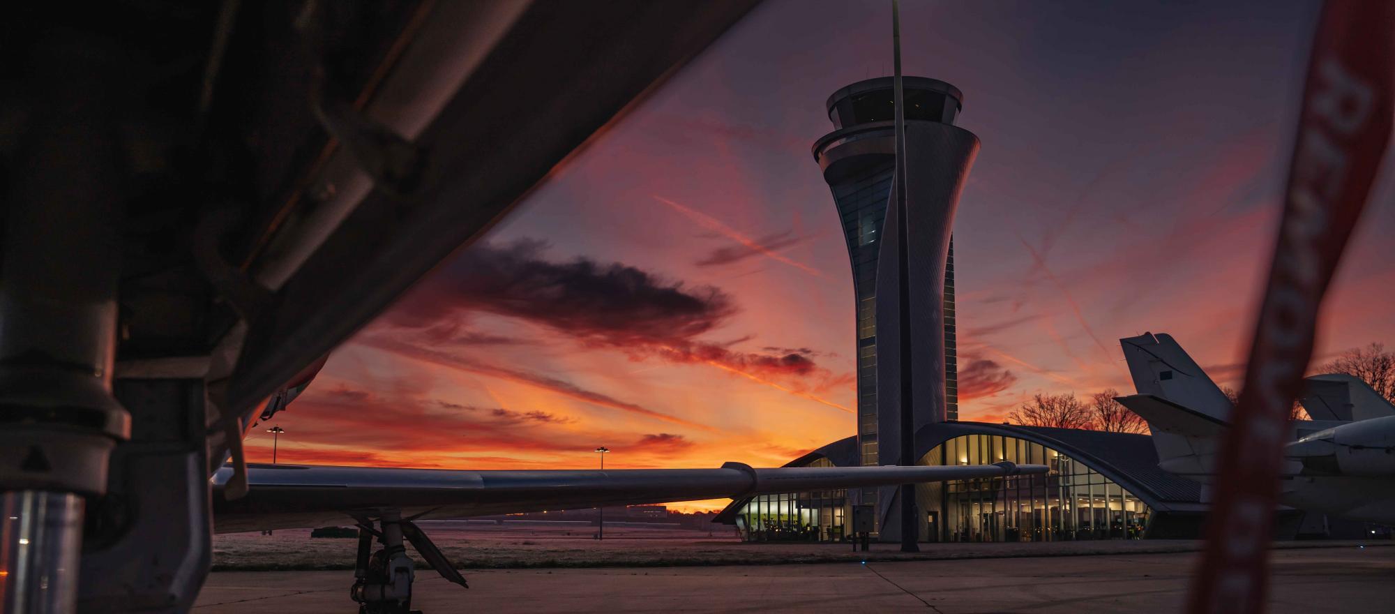 Airport control tower and FBO terminal at sunset